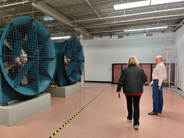 Two large mine ventilation blowers provide the airflow for the testing chamber. Pictured here, the presence of 6+ foot tall Lee Fithian and Tom Spicer illustrate how impressive these machines are.
